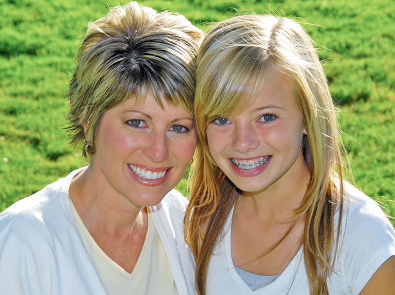 Mother with her daughter wearing braces.